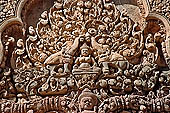 Banteay Srei temple - second enclosure, portico of the east gopura, a thick-breasted deity sits by two elephants with upraised trunks 